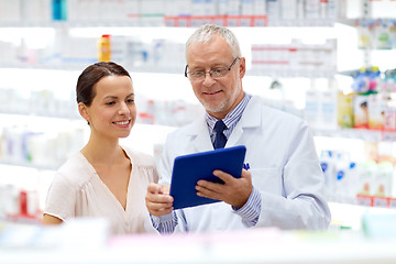 Image showing apothecary and customer with tablet pc at pharmacy