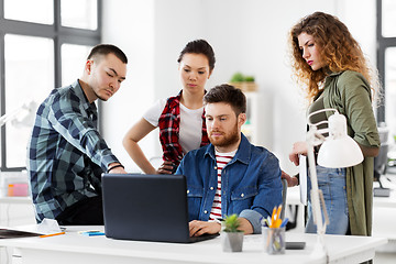 Image showing creative team with laptop working at office