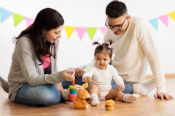 Image showing baby girl with parents playing with toys