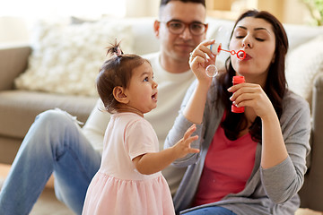 Image showing family with soap bubbles playing at home
