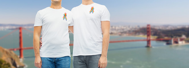 Image showing close up of couple with gay pride rainbow ribbons