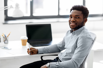 Image showing african american businessman with pen at office