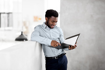 Image showing african american businessman with folder at office