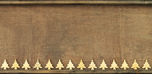 Image showing Christmas decoration wooden background with row of small wooden 