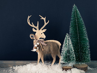 Image showing Christmas decoration wooden reindeer with fir trees