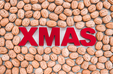 Image showing Walnuts surrounding the word Xmas written in red letters