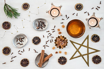 Image showing Cozy Christmas composition with candles and teacup