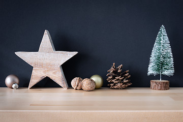 Image showing Christmas decoration glass balls with wooden star and fir tree