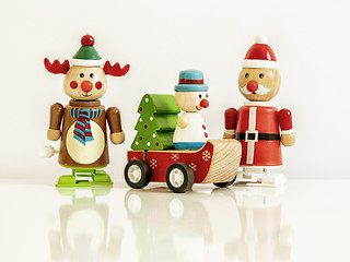 Image showing three Christmas figures reindeer Santa Claus toys