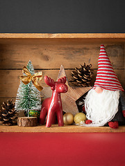 Image showing Christmas decoration deer figure and gnome in a wooden box backg