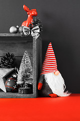 Image showing Christmas decoration deer figure and gnome in a wooden box backg