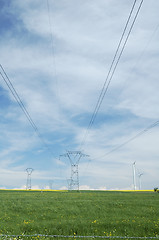 Image showing Electric pylons close to windturbines