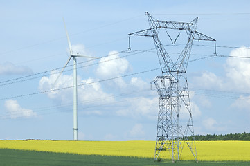 Image showing A electric pylon near windturbine