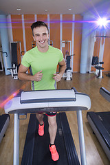 Image showing sportsman exercise jogging on treadmill