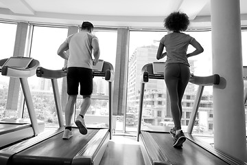 Image showing people exercisinng a cardio on treadmill in gym