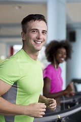 Image showing people exercisinng a cardio on treadmill