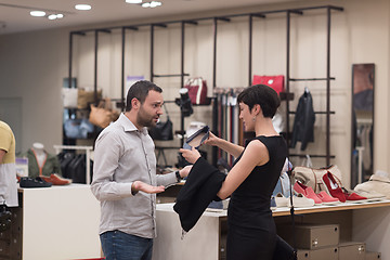 Image showing couple chooses shoes At Shoe Store