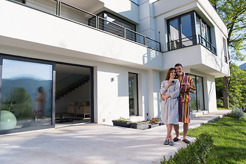 Image showing Young beautiful couple in bathrobes