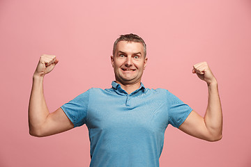 Image showing Winning success man happy ecstatic celebrating being a winner. Dynamic energetic image of male model