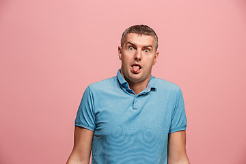 Image showing The squint eyed man with weird expression isolated on pink