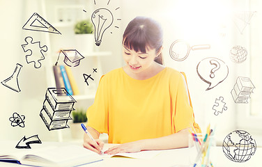 Image showing happy asian young woman student learning at home