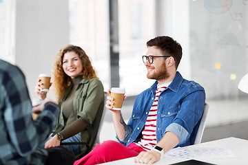 Image showing creative team drinking coffee at office