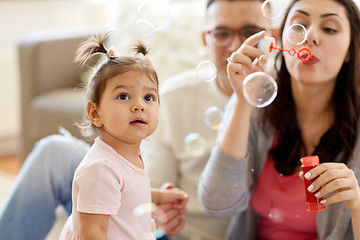 Image showing family with soap bubbles playing at home