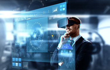 Image showing businessman in virtual reality headset and screen