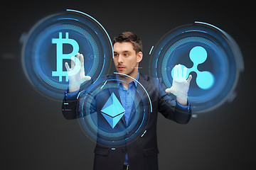 Image showing businessman with cryptocurrency holograms