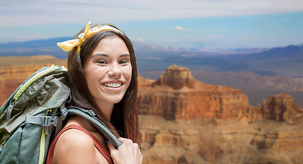 Image showing happy woman with backpack over grand canyon