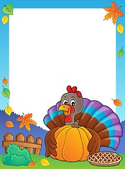 Image showing Turkey bird holding pumpkin frame 1