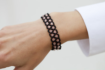 Image showing Stylish black bead bracelet on female hand