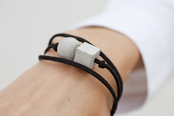 Image showing Stylish grey and black bead bracelet on female hand