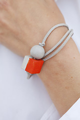 Image showing Stylish red and grey bead bracelet on female hand