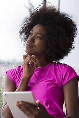 Image showing african american woman using tablet