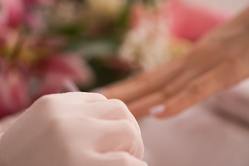 Image showing Woman hands receiving a manicure