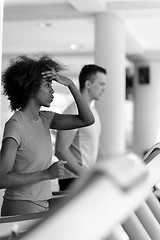 Image showing people exercisinng a cardio on treadmill in gym