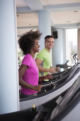 Image showing people exercisinng a cardio on treadmill in gym