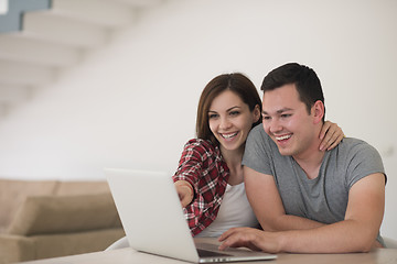 Image showing happy young couple buying online