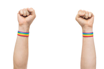 Image showing hands with gay pride rainbow wristbands shows fist