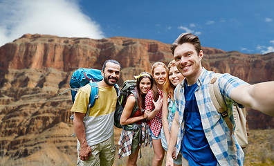 Image showing happy travelers taking selfie at grand canyon