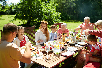 Image showing happy family having dinner or summer garden party