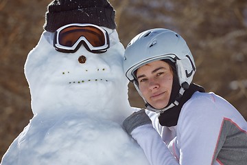 Image showing Building a snowman in a ski trip