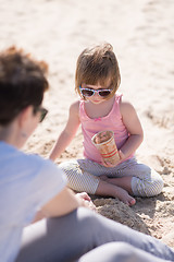 Image showing Mom and daughter on the beach