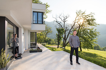 Image showing man in front of his luxury home villa