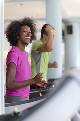 Image showing people exercisinng a cardio on treadmill