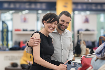 Image showing couple chooses shoes At Shoe Store