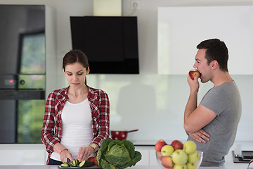 Image showing Young handsome couple in the kitchen