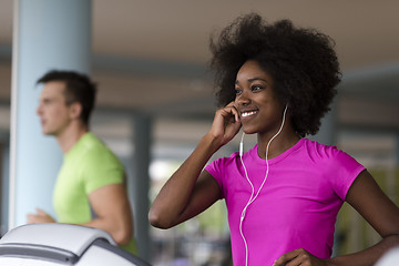 Image showing people exercisinng a cardio on treadmill