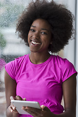 Image showing african american woman using tablet